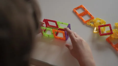 Child Creates Figures With Magnetic Construction Set. Boy Playing With Magnetic Stock Footage 279469408