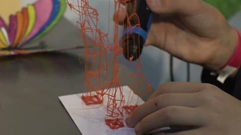 Child creating 3d toy, three dimensional object, innovative technology at school Stock Footage 91858447