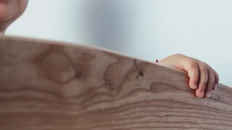 The Child in The Crib . Keeps Hands. Happy child. Stock-Footage 53255041