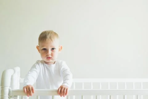 Child in the crib Stock Photos
