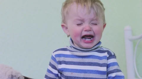 The child is crying and screaming. Child abuse, stress, punishment, pain Stock Footage
