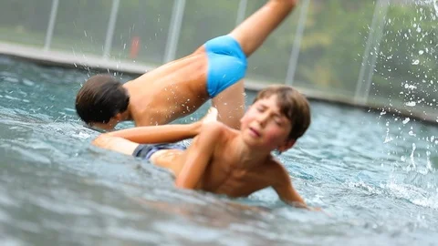 Child crying inside pool. Young boy sobs and cries after being hurt. Real aut Stock Footage 88983451