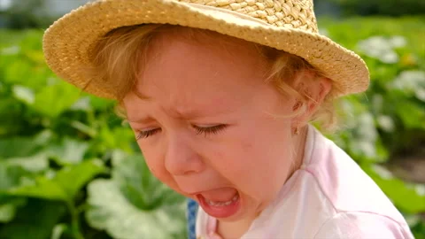 The child is crying in the park. Selecti... | Stock Video | Pond5