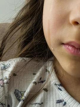 Child crying with a tear on the cheek Stock-Fotos