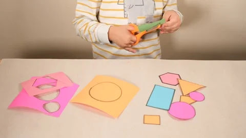 Child cutting cardboard Stock Footage 257697702