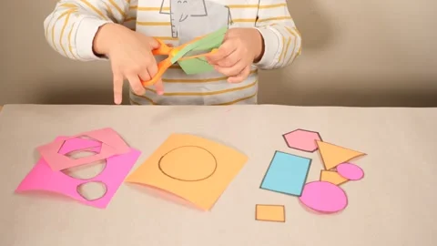 Child cutting colored cardboard Stock Footage 258283507