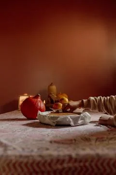 Child cutting homemade cake on patterned tablecloth Stock Photos