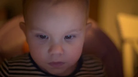 Child cwatching something on the tablet Stock Footage 72438164