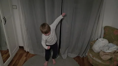 Child dancing barefoot in bedroom Stock Footage 308684128
