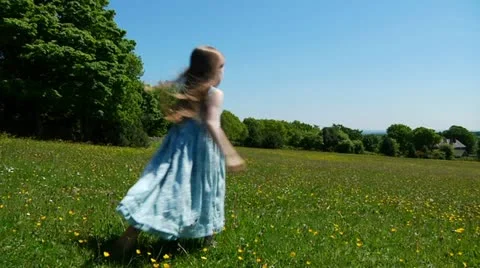 Child dancing in meadow Stock Footage 22636984