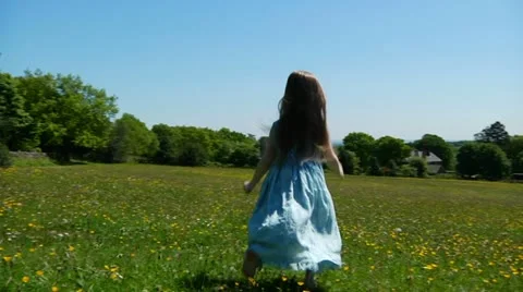 Child dancing in meadow Stock Footage 22636993