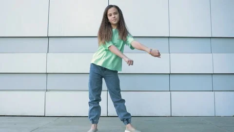 The child is dancing a modern pop dance Stock Footage 154560809