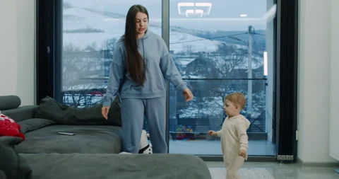 The child is dancing with the mother Video stock 150641868