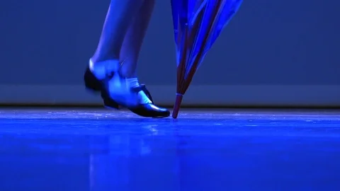 Child dancing taps with umbrella Stock Footage 97634222