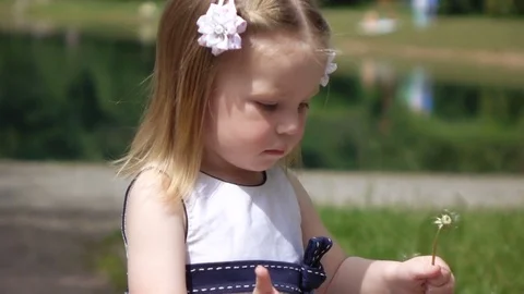 Child with dandelion Stock Footage