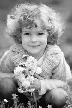 Child with dandelion Stock Photos