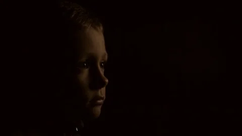 A child in the dark is watching TV Stock-Footage 80469220