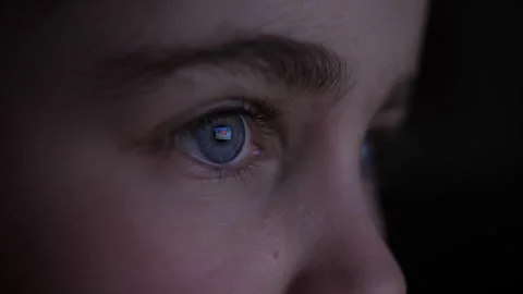 Child in Dark is Watching TV Playing Video Game. Close-up Face of Little Gi.. Stock Footage 315696558