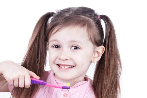 Child decayed teeth with toothbrush on white background Stock Photos