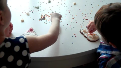 Child decorate cookies Stock Footage 85519892
