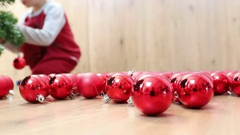 Child decorates Christmas tree Video stock 83090631