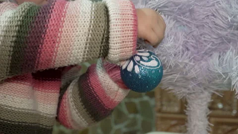 Child decorates a Christmas tree Stock-Footage 158910551