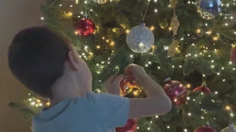Child Decorating Christmas Tree Close View Hanging Ornament Festive Family Stock Footage 344881831
