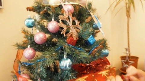 Child decorating christmas tree Stock Footage 86890599