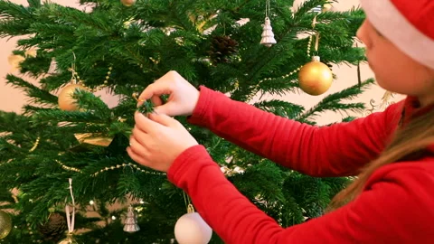 Child decorating Christmas Tree Stock Footage 161180877