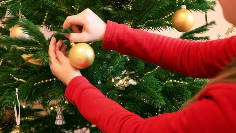 Child decorating Christmas Tree Stock Footage 161182300