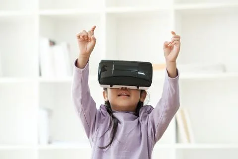 Child Delighted by Virtual Reality Experience Foto stock