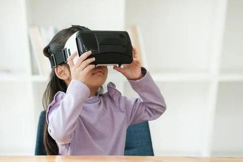Child Delighted by Virtual Reality Experience 写真素材