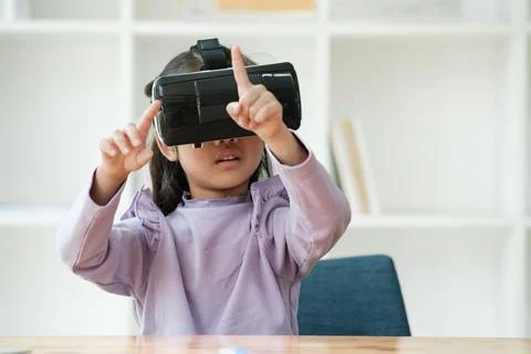 Child Delighted by Virtual Reality Experience Foto stock