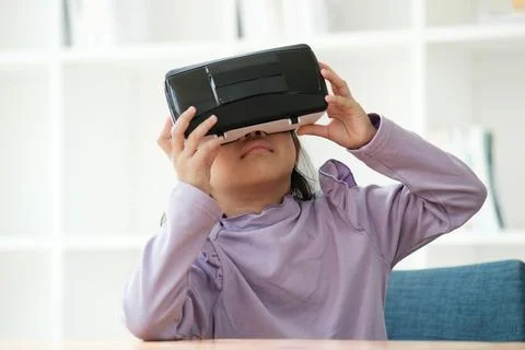 Child Delighted by Virtual Reality Experience 写真素材