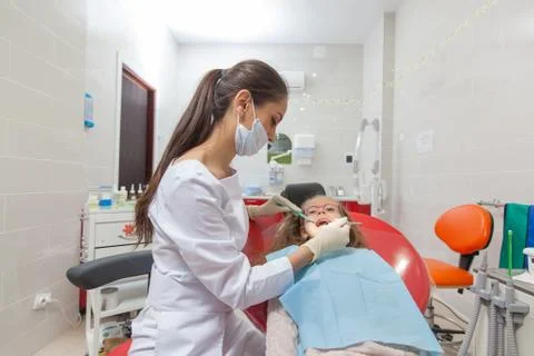 A child with a dentist in a dental office. Stock Photos