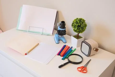 Child Desk With Microscope And Science Learning Tools Stock Photos