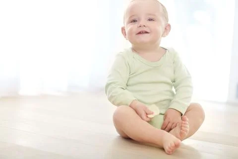 Child development, milestone and teething with happy toddler on floor in li.. Stock Photos