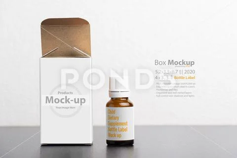 Child dietary supplement glass bottle with package isolated on gray backgroun PSD Template