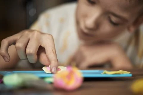 Child with Disability Engaging in Creative Arts and Crafts Activity Stockfoto's