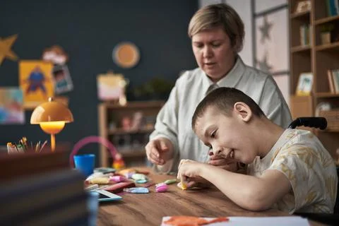 Child with Disability Learning with Teacher in Classroom Environment Stock Photos