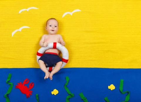 Child is diving into imaginary pool. Dreaming about sea, vacation Stock Photos