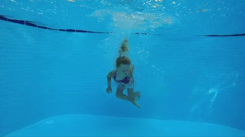 Child diving in the pool Stock Footage 81504508