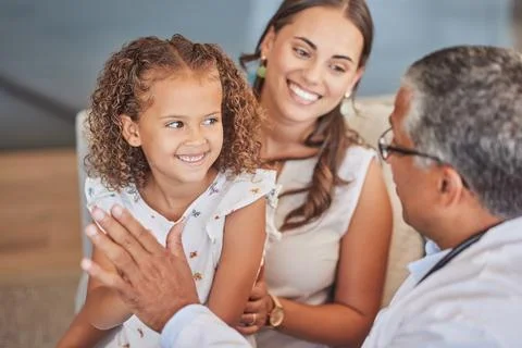 Child doctor, pediatrician and high five with happy girl patient with mom parent Stock Photos