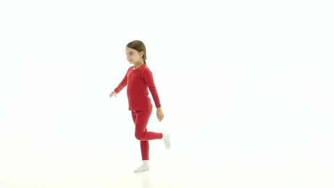 Child does acrobatic movements. White background. Slow motion 스톡 동영상 80705415