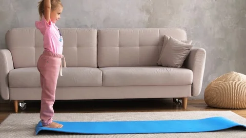 The child does gymnastics Stock Footage 126838674