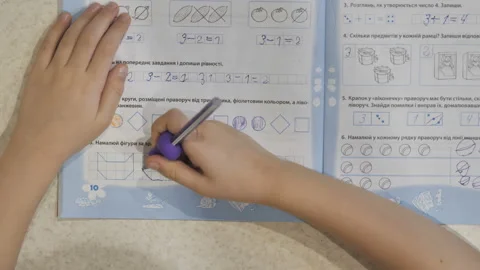 The child does homework after school.  Stock Footage 122755111