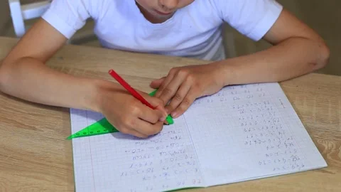 A child does homework on isolation. Homework. Video stock 140368658