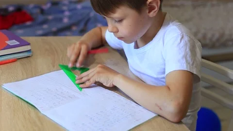 A child does homework on isolation. Homework. Video stock 140368715