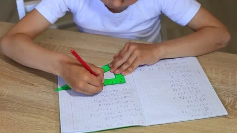 A child does homework on isolation. Homework. Stock Footage 140370441