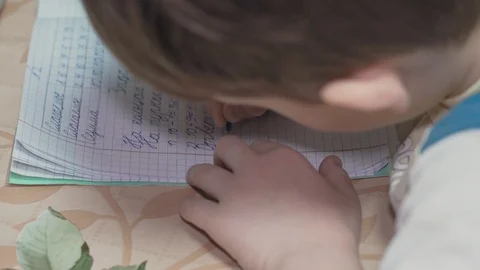 The child does lessons in Russian Stock Footage 128496944